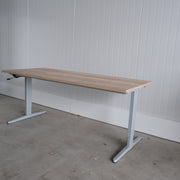 Slingerbureau zit-zit 180x80 cm - Grijs frame - Nieuw midden eiken blad - H63-84 cm BR70
